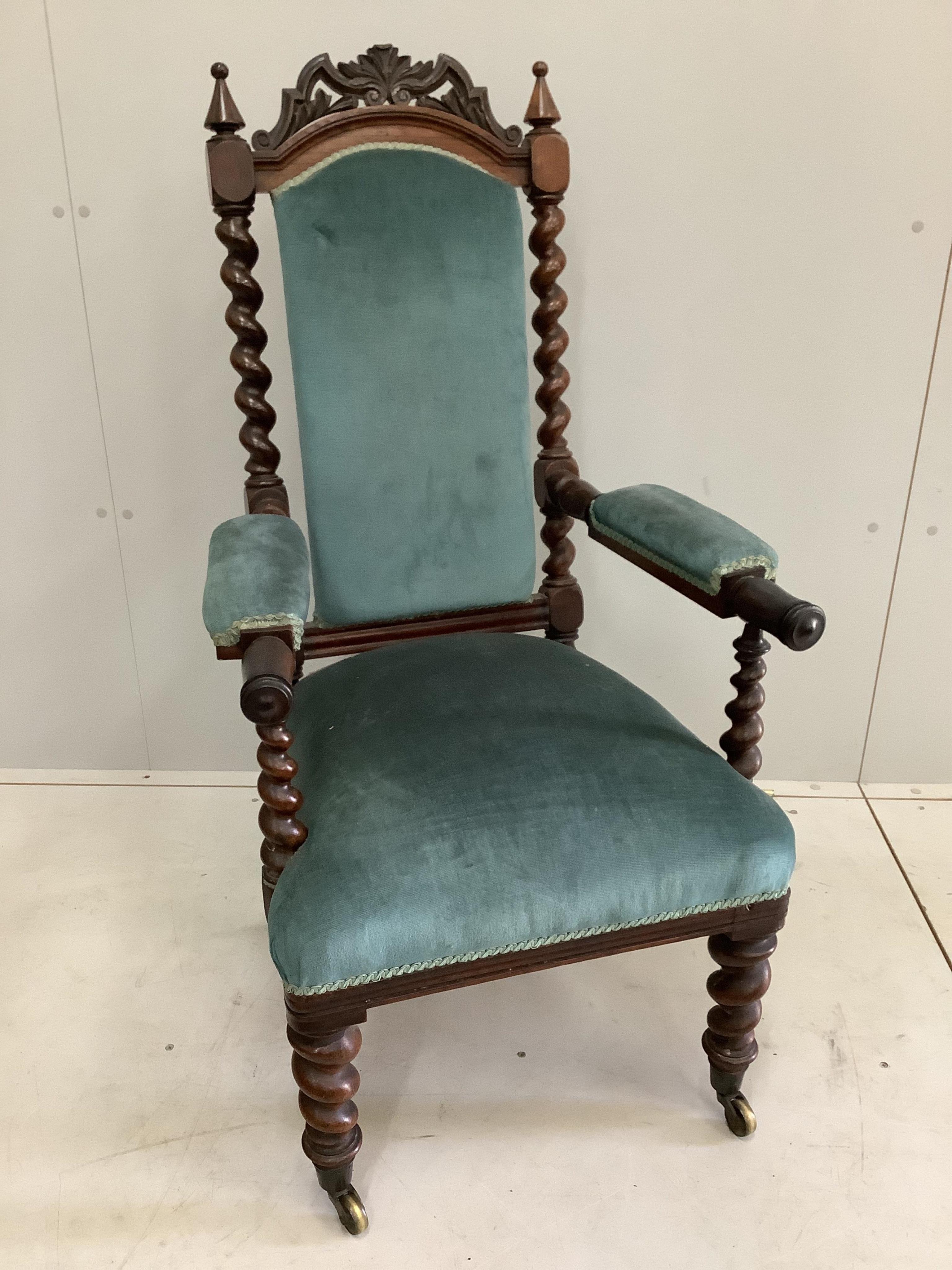 A Victorian Carolean style rosewood open armchair, width 58cm, depth 60cm, height 111cm